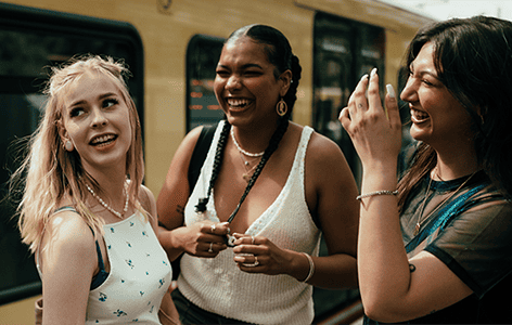 Generation Z friends hanging out waiting for the train