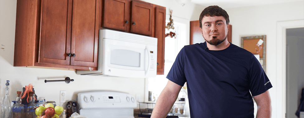 Man standing in kitchen
