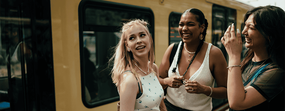 Gen Z friends on subway platform