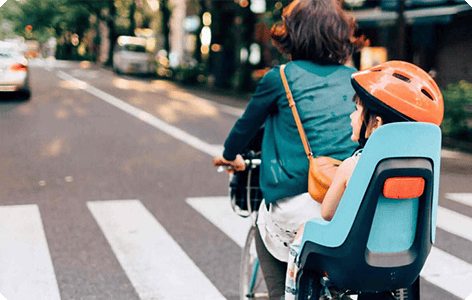 Two humans on a bike
