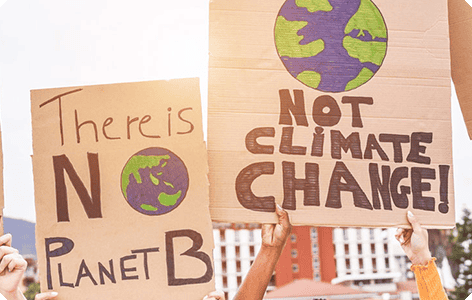 Posters of "There is no planet B" and "Not climate change!"