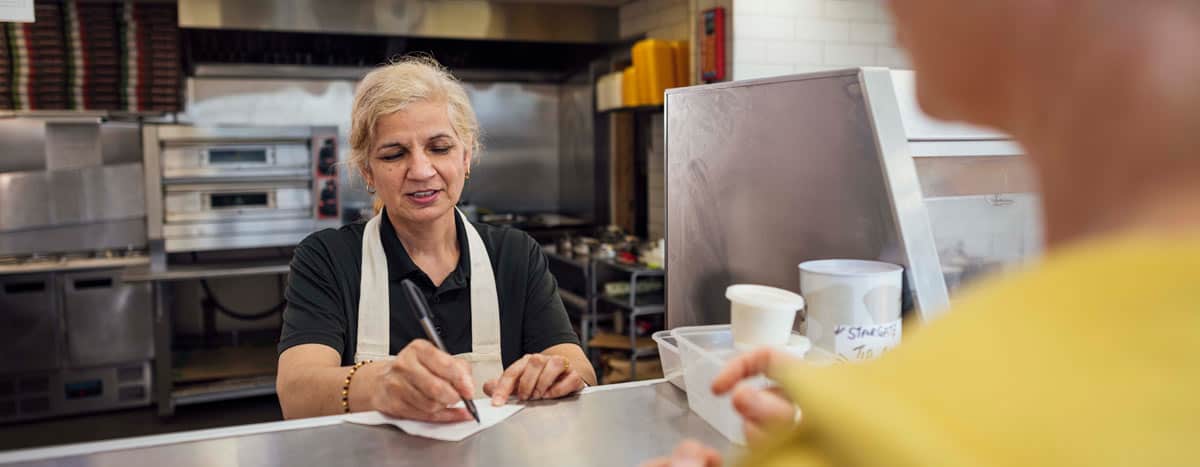 Women taking orders at a restaurant