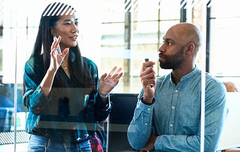 Two colleagues discussing