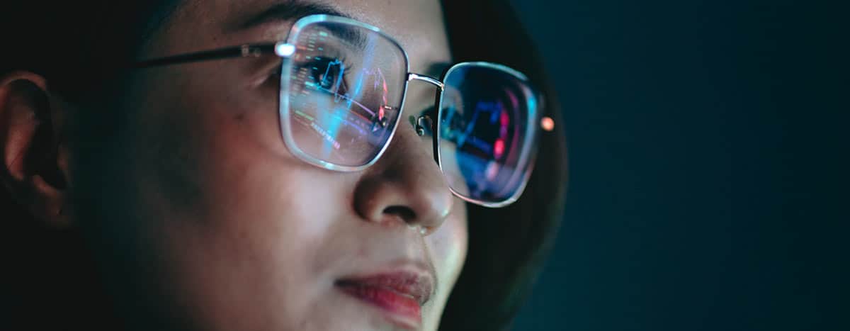 Lady wearing glasses reflecting AI