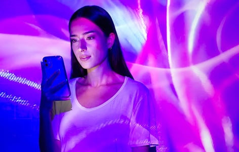 An AI image of a girl looking at her phone