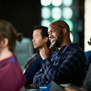 Man listening at a conference