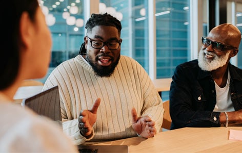 Three colleagues having a discussion