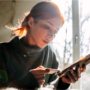 Woman with credit card and mobile phone