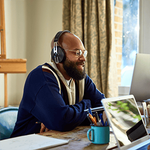 Man with headphones working from home