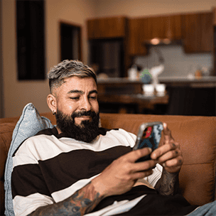 Man on his phone at home