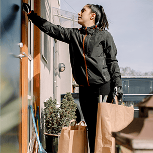 Woman dropping off groceries