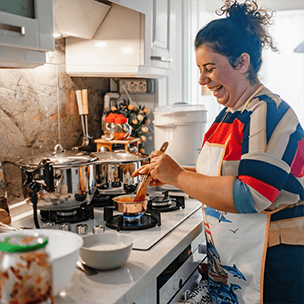 Woman cooking in her kitchen