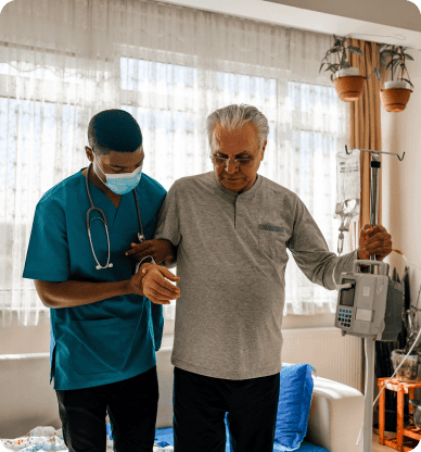 A health worker helping a patient walk