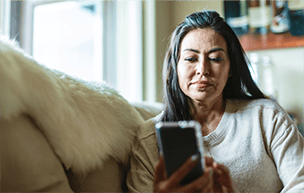 Woman on phone on the couch