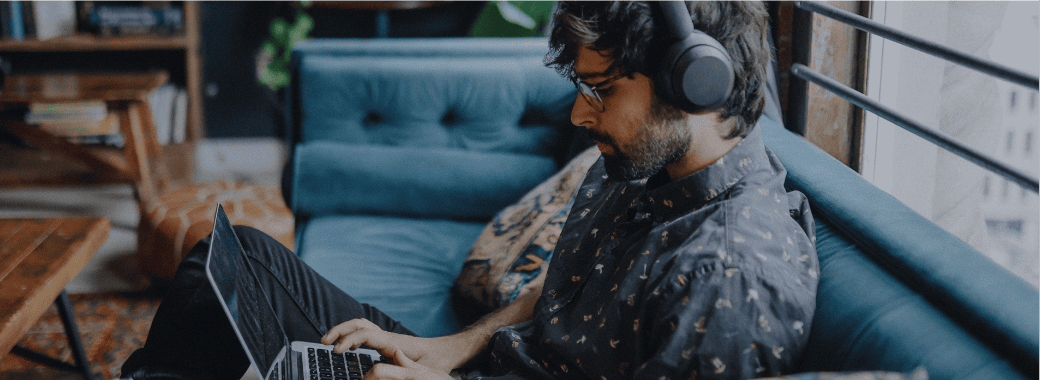 Man working on the couch
