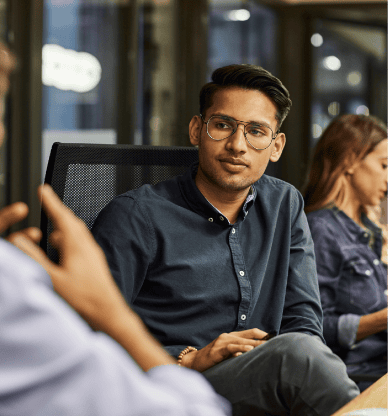 Employees Working Together in Meeting