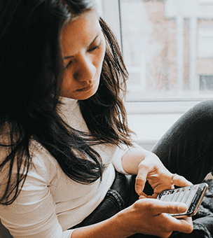 Woman participating in online community on mobile