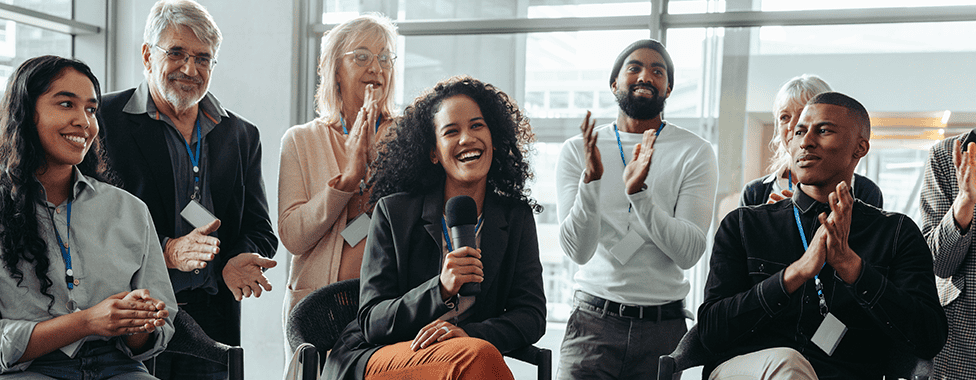 Colleagues clapping in an office environment