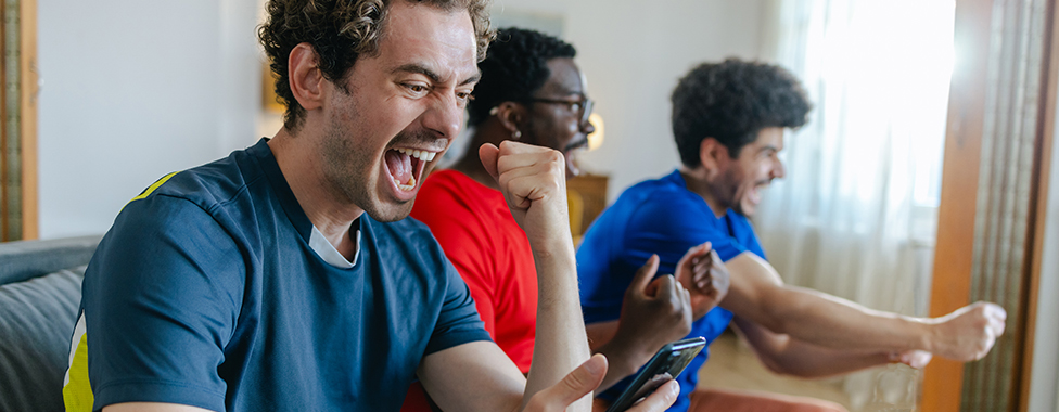 Three men enjoying playing video games