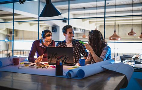 Three people collaborating